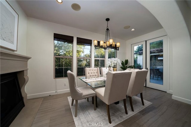102 Catalonia, Irvine, CA 92618 - dining area with baseboards, a wealth of natural light, and a fireplace