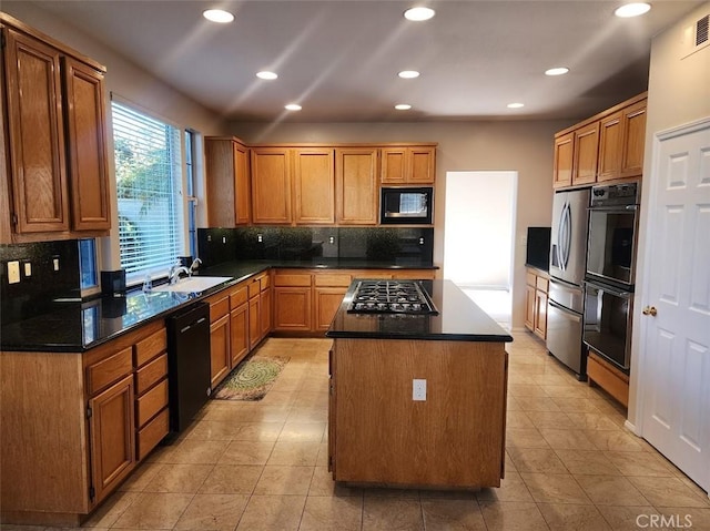 kitchen featuring a center island, backsplash, black appliances, sink, and light tile patterned flooring