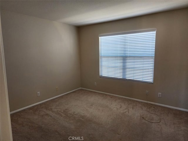 view of carpeted spare room