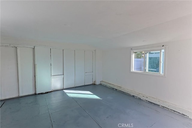 unfurnished bedroom featuring vaulted ceiling