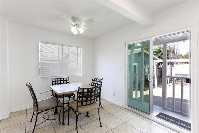 tiled dining room featuring beam ceiling and ceiling fan