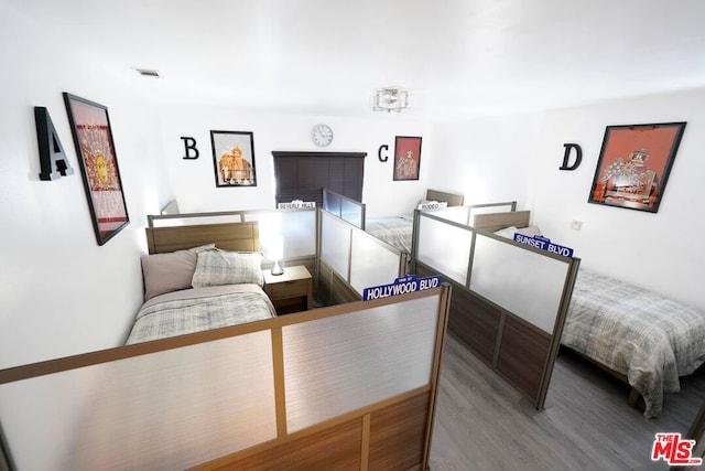 bedroom featuring hardwood / wood-style flooring