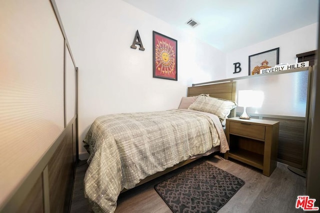 bedroom featuring hardwood / wood-style flooring