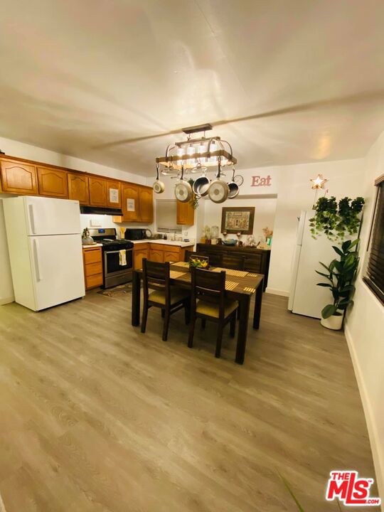 dining space with light hardwood / wood-style flooring