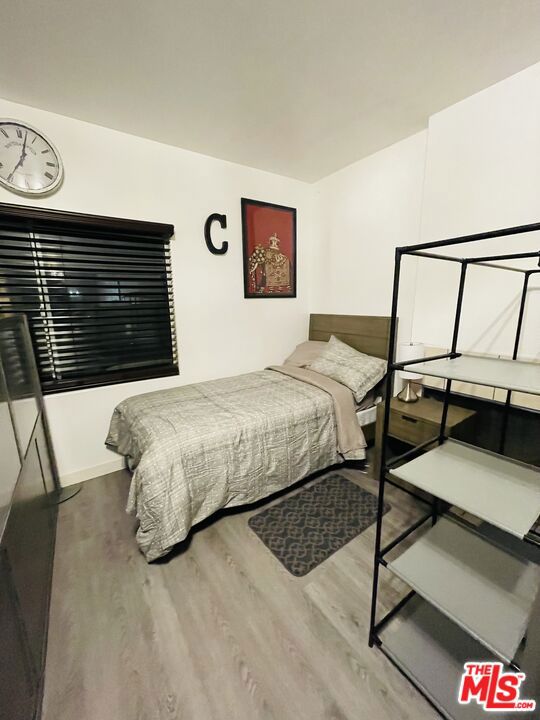 bedroom with wood-type flooring