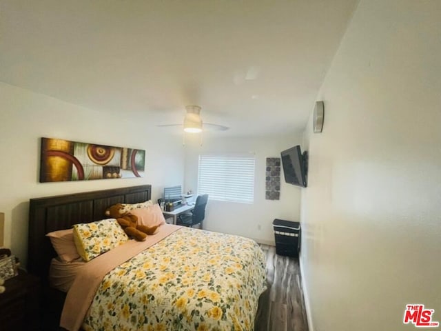 bedroom with hardwood / wood-style flooring and ceiling fan