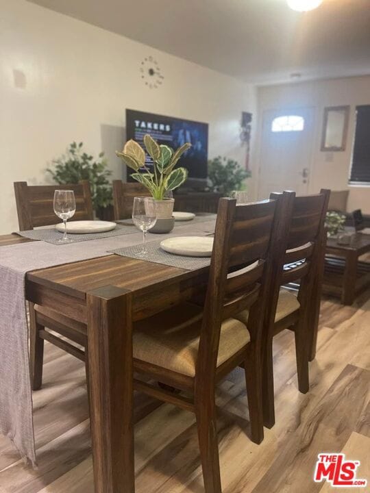 dining space with light wood-type flooring