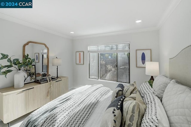 bedroom with ornamental molding