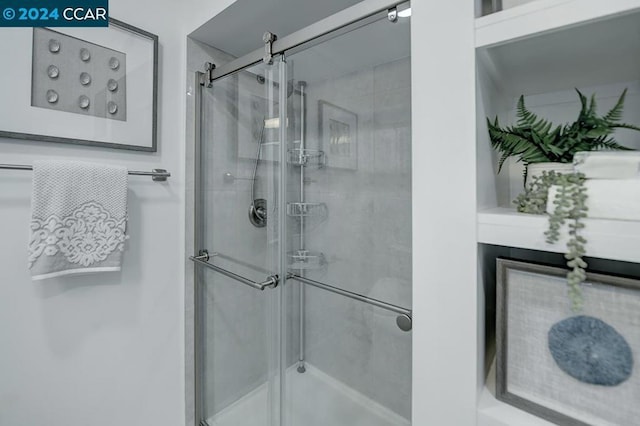 bathroom featuring an enclosed shower