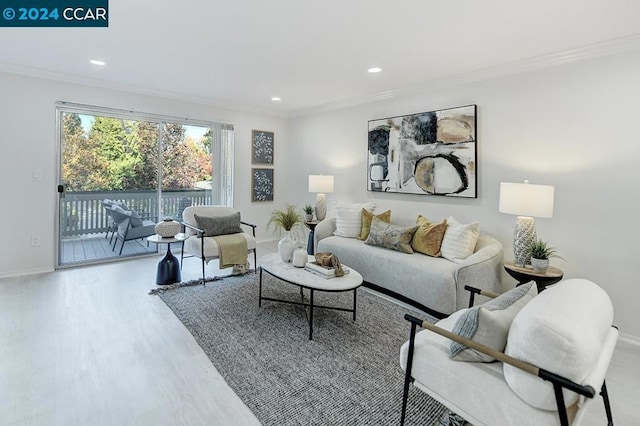 living room featuring ornamental molding and hardwood / wood-style flooring