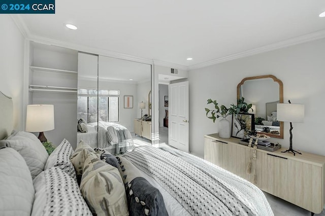 bedroom featuring a closet and ornamental molding