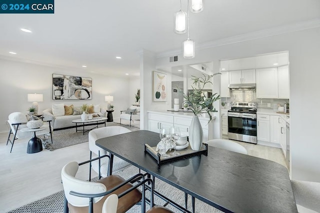 dining room featuring crown molding