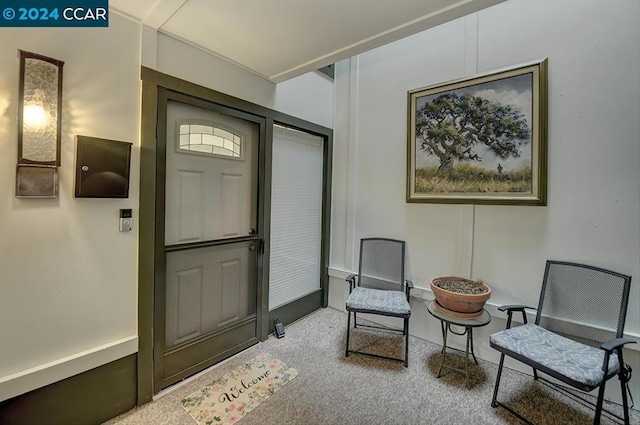 sitting room with carpet floors