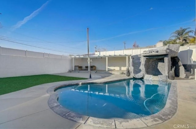 view of pool featuring a patio area, a fenced backyard, and a fenced in pool