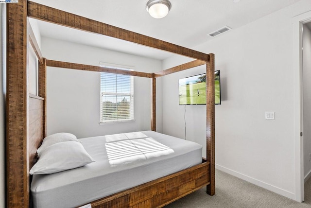 bedroom with light colored carpet