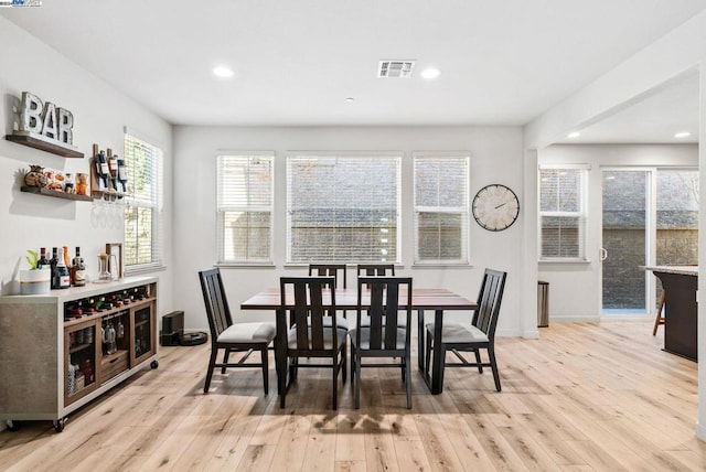 dining space featuring light hardwood / wood-style floors