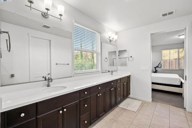 bathroom with tile patterned flooring and vanity