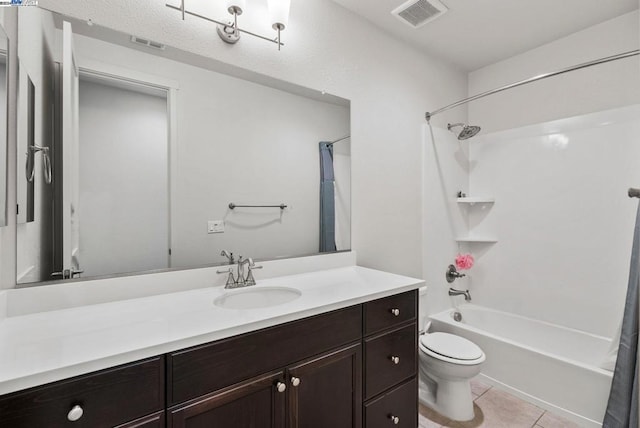 full bathroom featuring tile patterned floors, vanity, toilet, and shower / bath combo with shower curtain