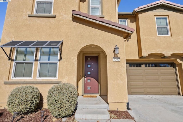 property entrance with a garage