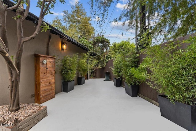 view of side of home featuring a patio area