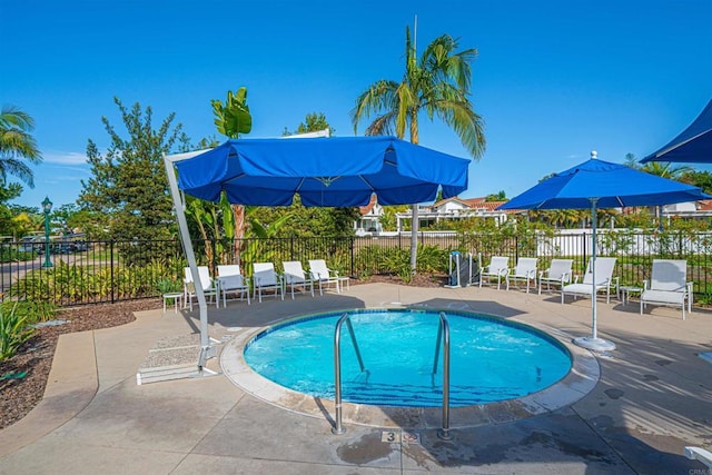 view of swimming pool featuring a patio area