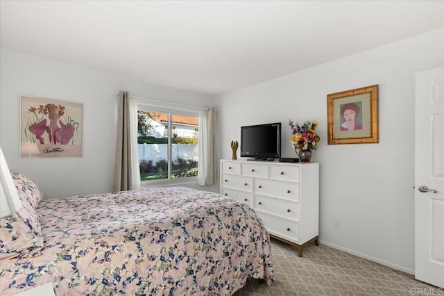 bedroom featuring light colored carpet