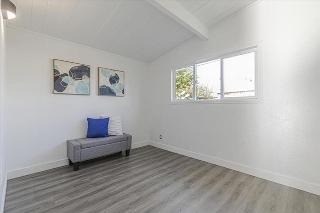 living area featuring hardwood / wood-style flooring, wooden ceiling, and lofted ceiling with beams