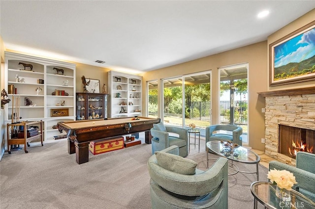 recreation room with visible vents, carpet floors, a stone fireplace, and billiards