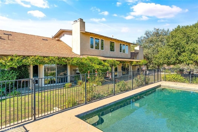 view of pool with fence and a fenced in pool