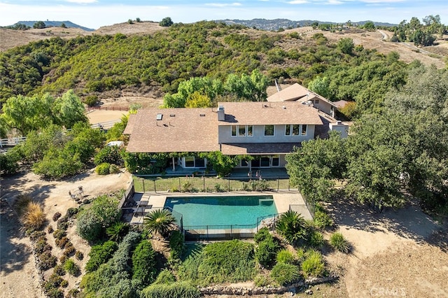 view of swimming pool featuring a fenced in pool, a patio, and fence