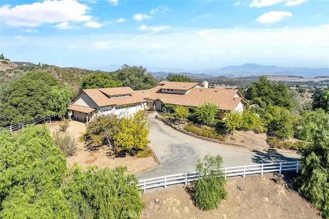 birds eye view of property featuring a mountain view