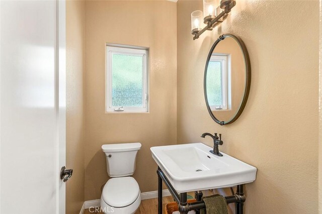 bathroom with toilet and sink