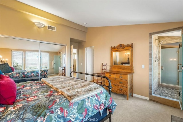 bedroom featuring light carpet, a closet, and lofted ceiling