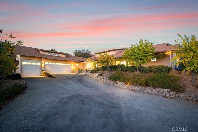 view of front of property with a garage