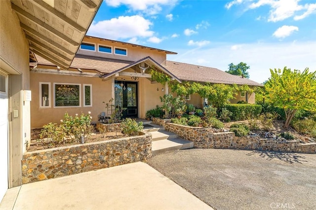 doorway to property with a patio