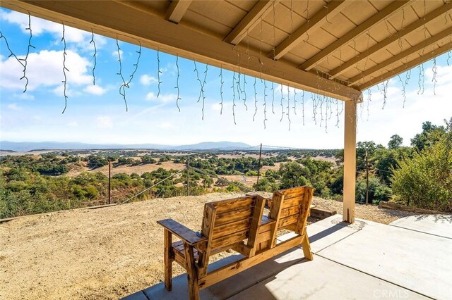 view of patio / terrace with a mountain view