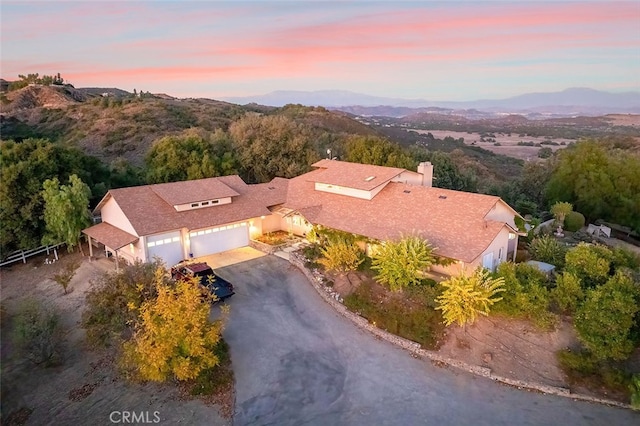 aerial view at dusk with a mountain view