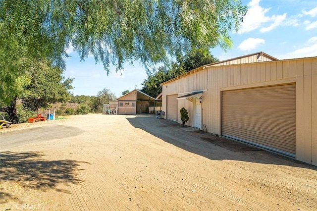 exterior space featuring an outbuilding