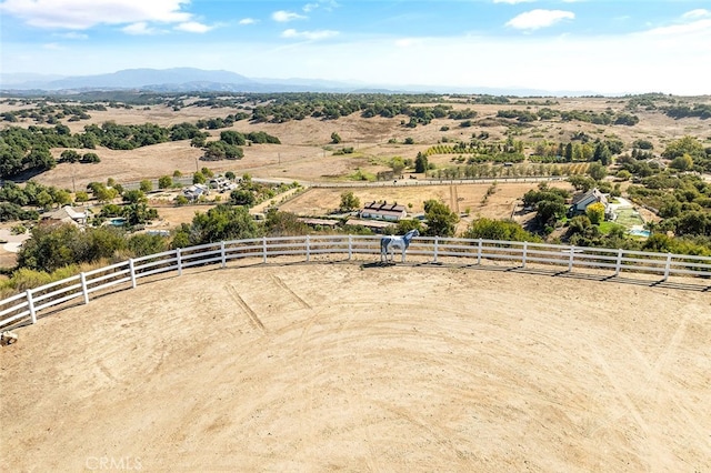 birds eye view of property featuring a mountain view and a rural view