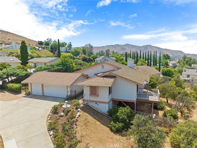 view of front of home featuring a garage and a mountain view