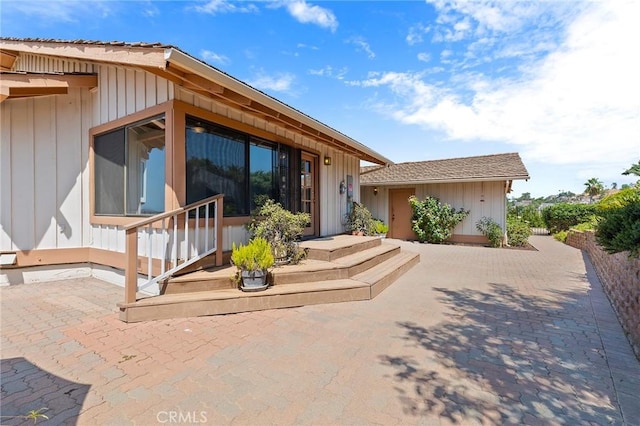 back of property featuring a patio area