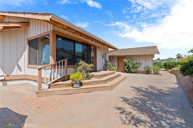 back of house with a patio