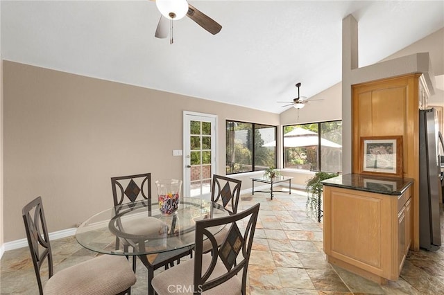 dining room with vaulted ceiling and ceiling fan