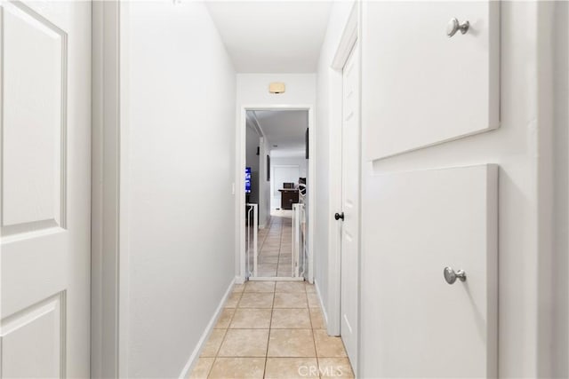 corridor with light tile patterned floors