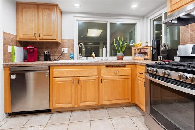 kitchen with ventilation hood, sink, light tile patterned floors, appliances with stainless steel finishes, and tasteful backsplash