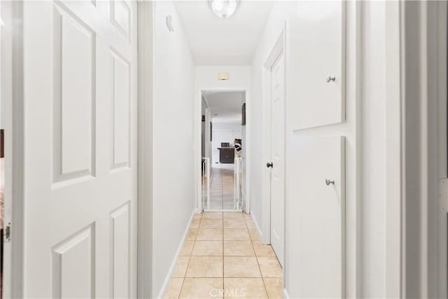 hallway with light tile patterned floors