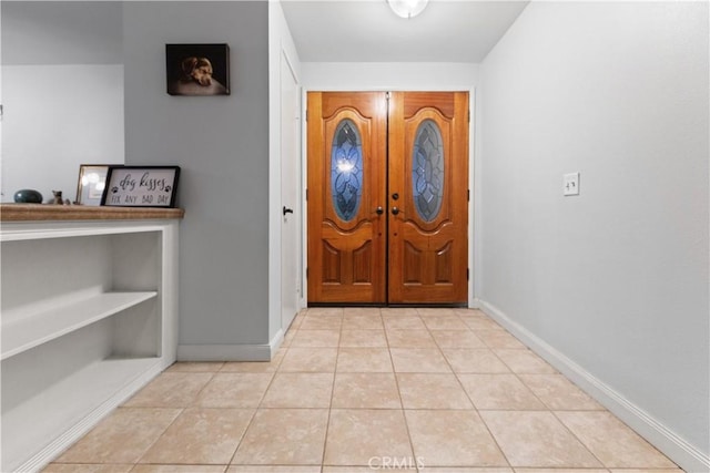 foyer with light tile patterned floors