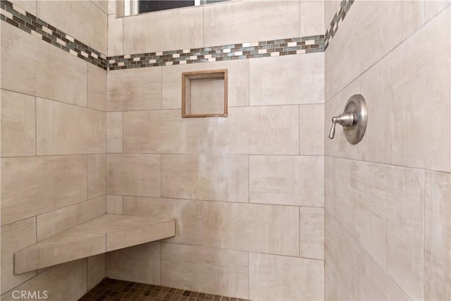 bathroom with tiled shower