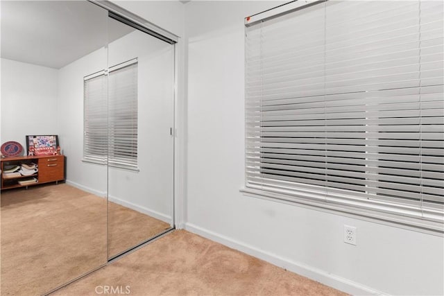 carpeted bedroom with a closet