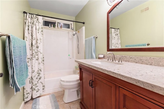 full bathroom featuring tile patterned floors, vanity, shower / bath combination with curtain, and toilet